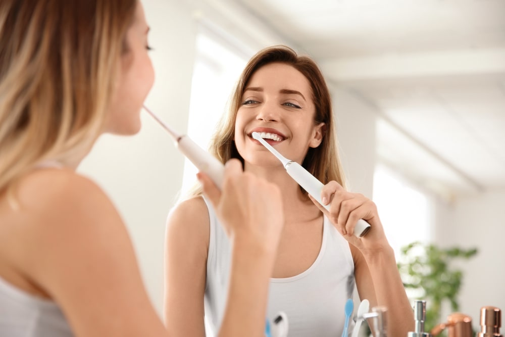 happy women tooth brushing.