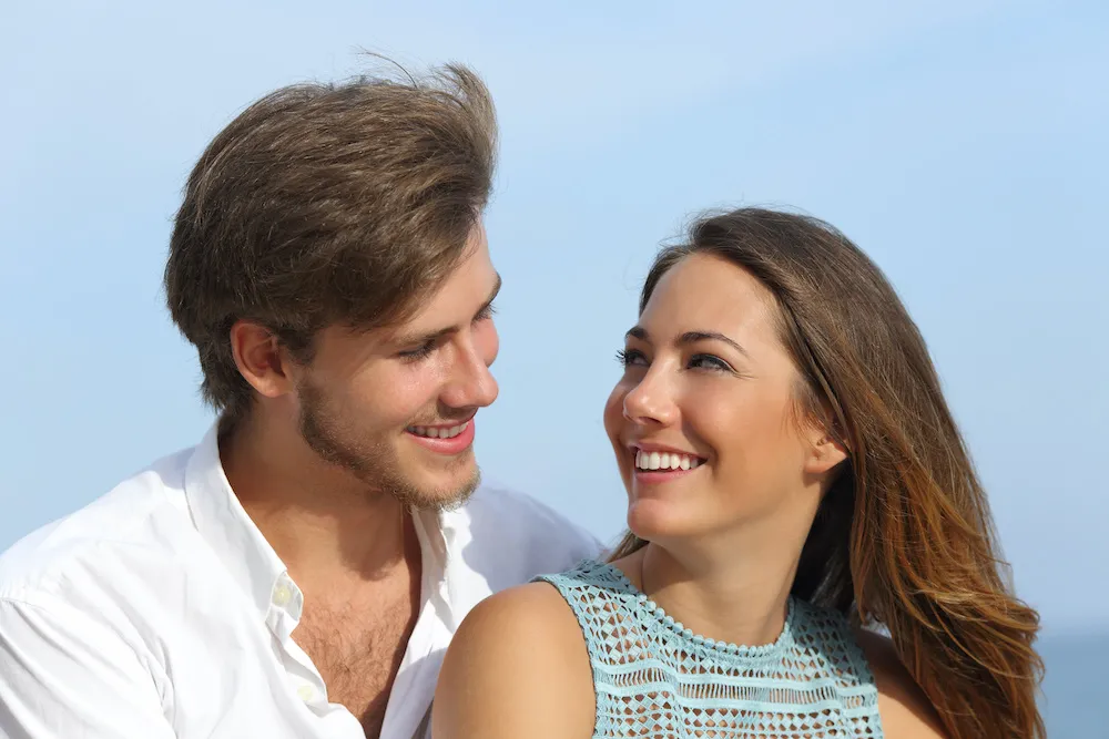 Happy couple in love looking each other